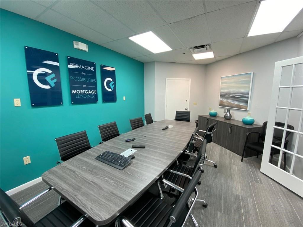 Office area with a paneled ceiling