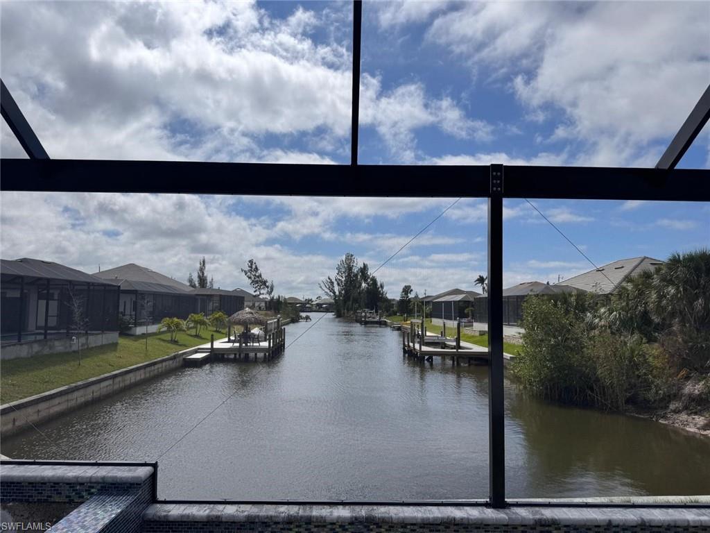 View of water feature with a boat dock and a residential view