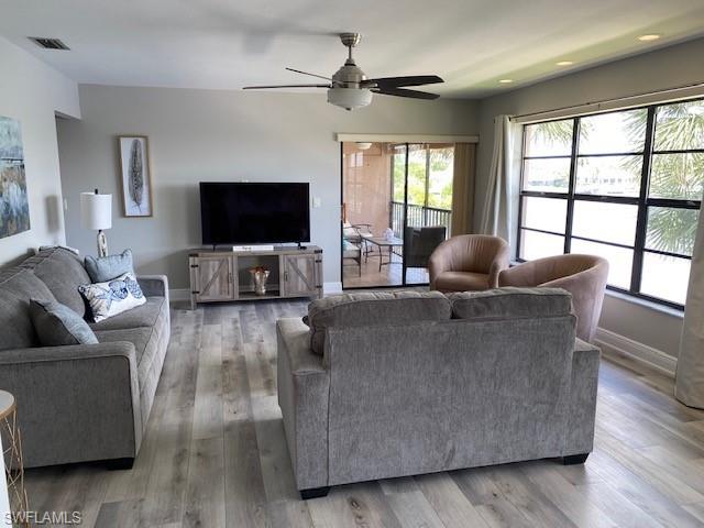 The Living area has slider door access to the screened balcony and the large windows provide plenty of natural light and great views.