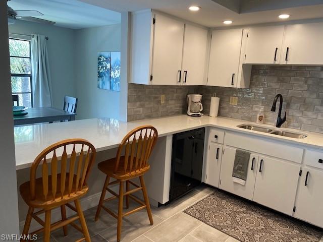 Large pass through to Dining area provides great workspace. Quartz counters, tile backsplash and tile flooring make for easy cleaning after that perfect meal. You can even enjoy your water view from the Kitchen!