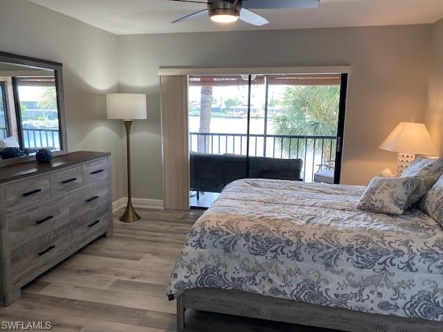 The Master Bedroom has a Queen-sized bed and sliding glass door to the screened balcony, tile flooring and remote ceiling fan/light.