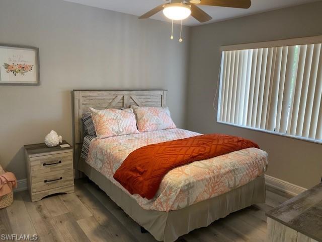 The Guest Bedroom features a Queen-sized bed, lighted remote ceiling fan and tile flooring.