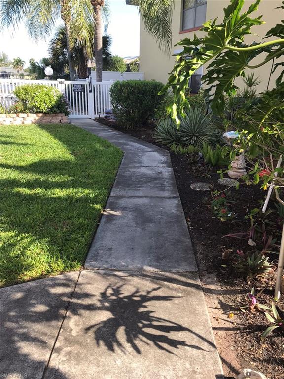 Landscaped walkway to the community pool.