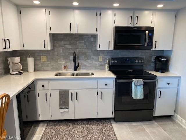 Crisp and clean kitchen with full appliances-Side by side refrigerator with ice maker, smooth top range, microwave and dishwasher.