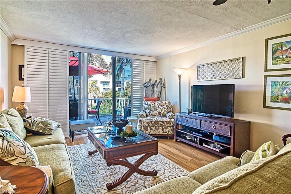 Dining space featuring crown molding and light wood-style floors