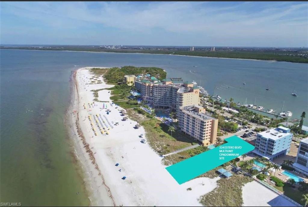 Aerial view with a water view and a beach view