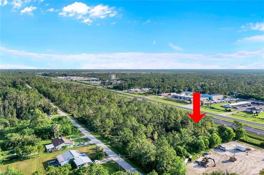 View of property location featuring a heavily wooded area