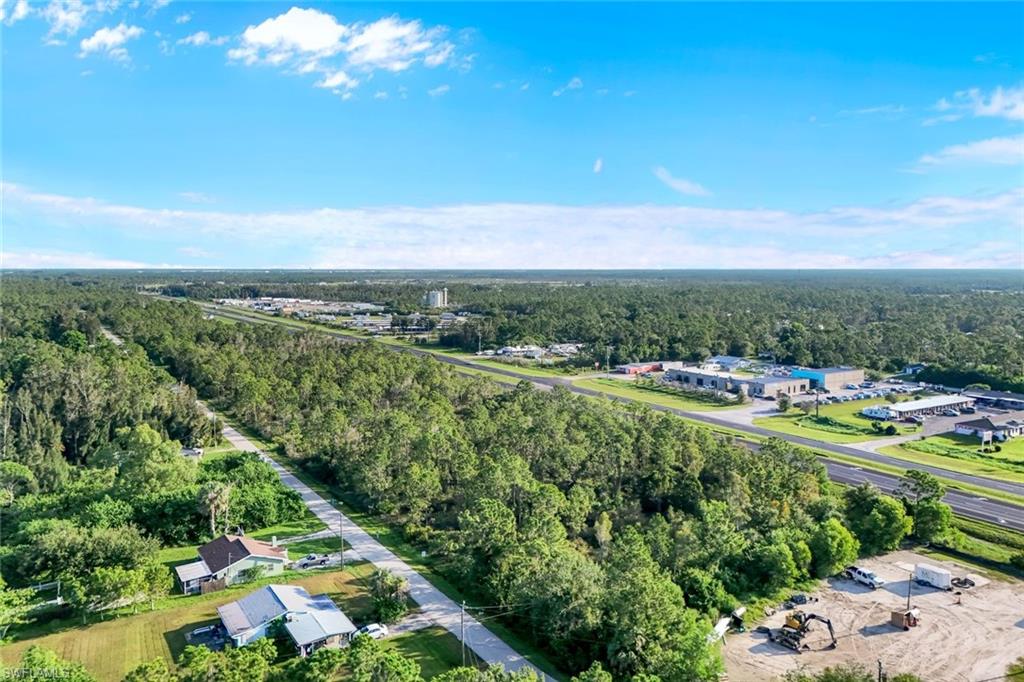 Aerial view of property's location featuring a forest