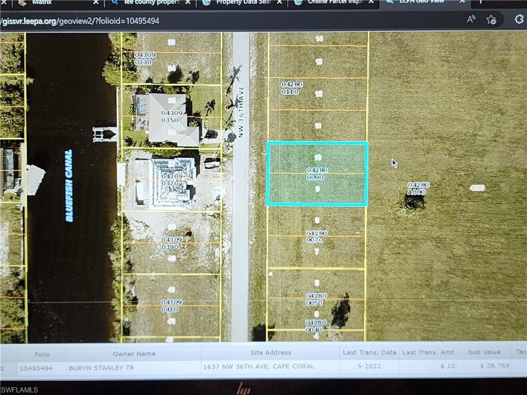 Across from new golf access homes.
