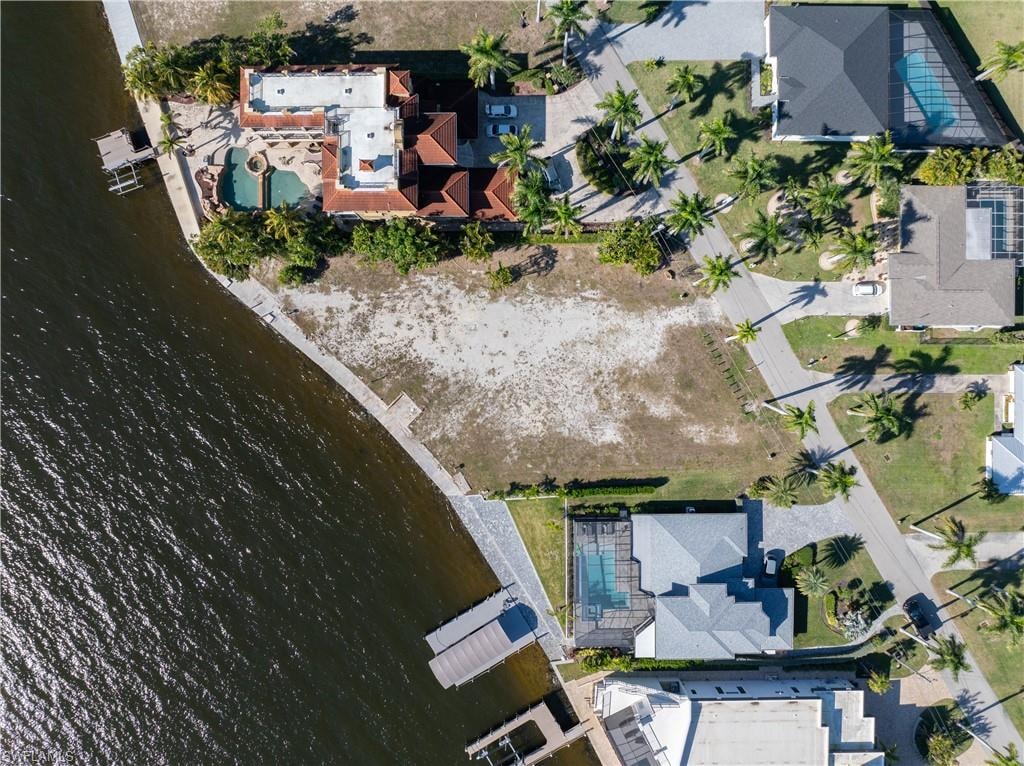 Aerial perspective of suburban area with a large body of water