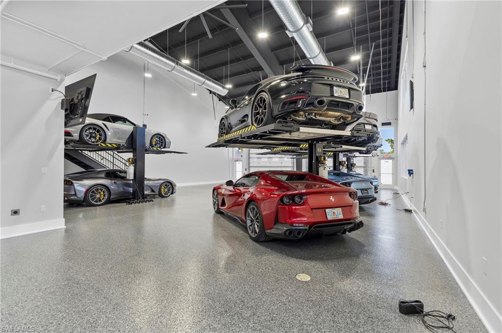 Garage featuring baseboards