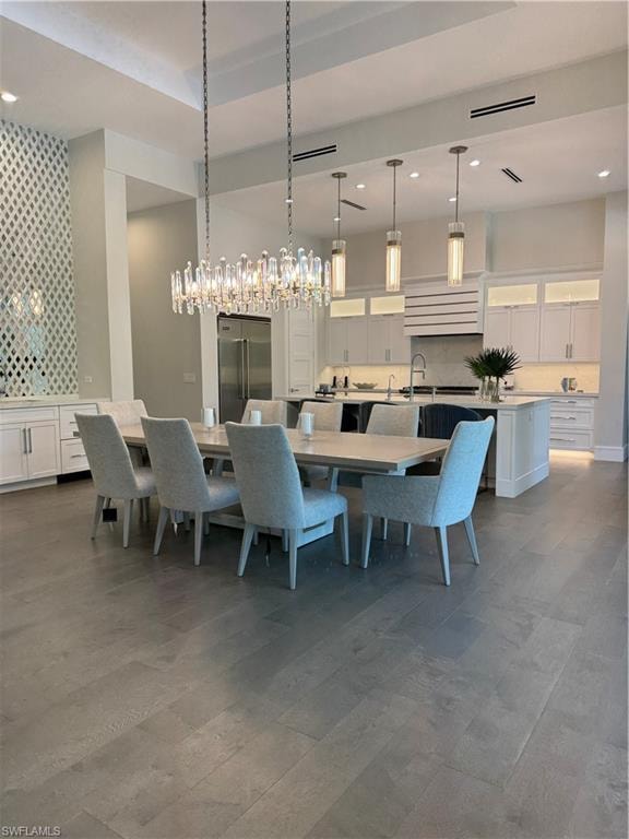 Dining space featuring visible vents and recessed lighting