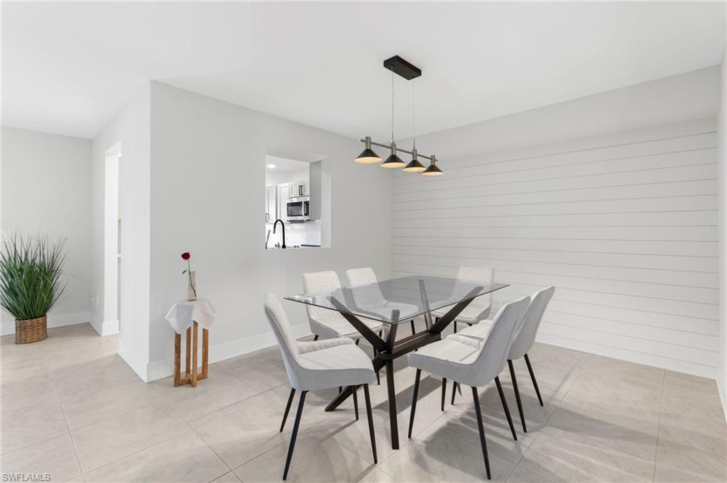 Tiled dining room with sink