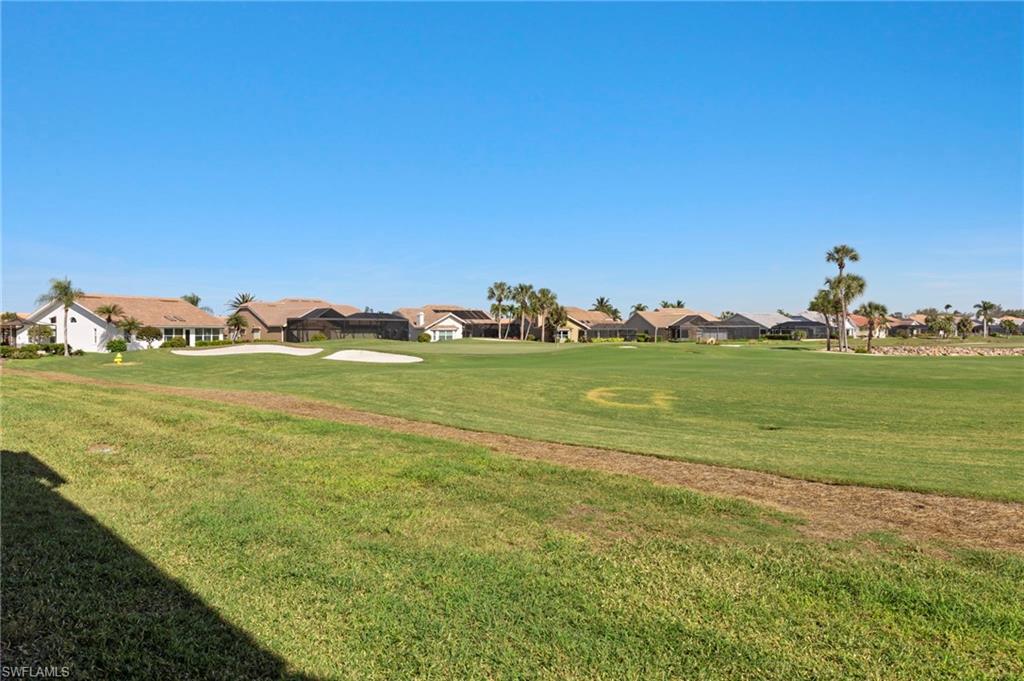 View of property's community featuring a yard