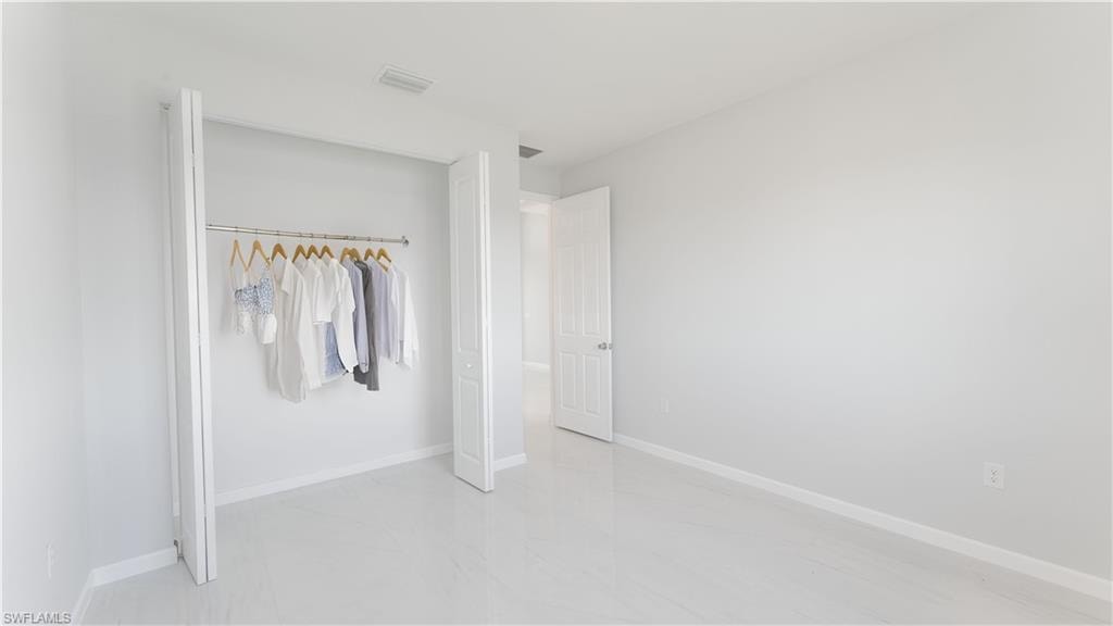 Unfurnished bedroom featuring a closet