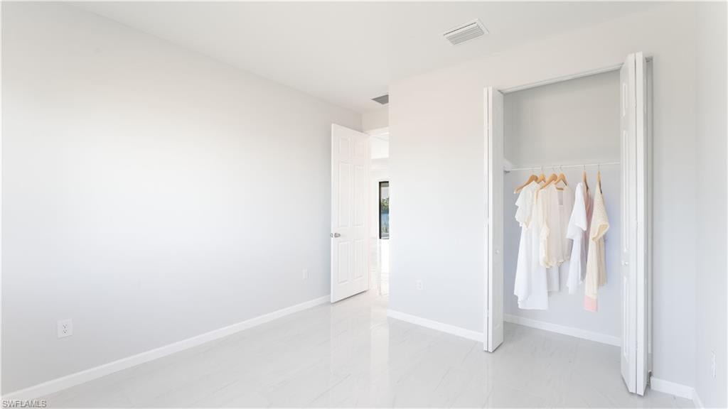 Unfurnished bedroom featuring a closet