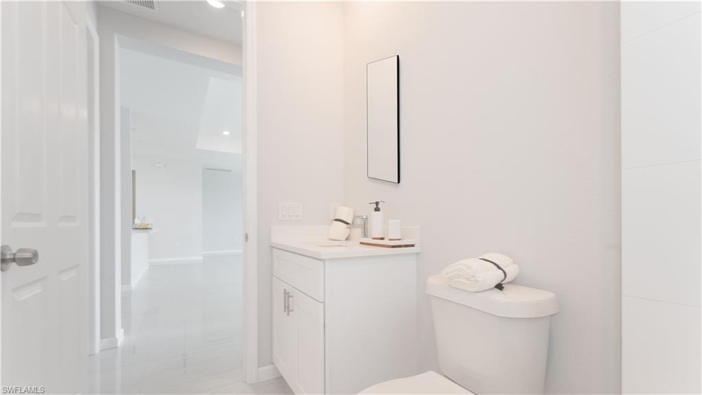 Bathroom featuring toilet and vanity