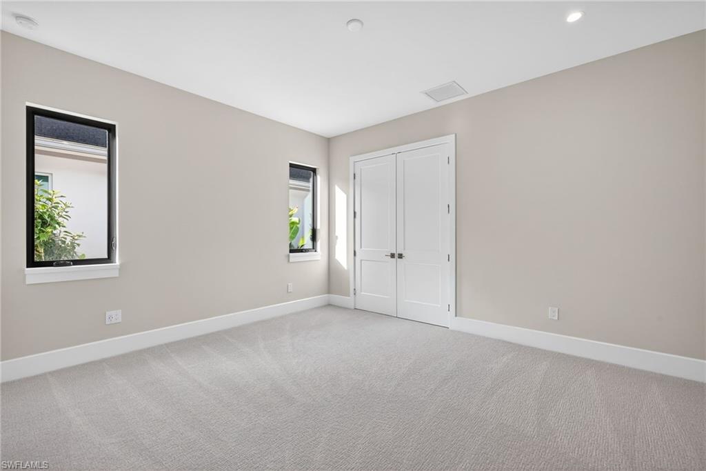 Bedroom 3 featuring light carpeting