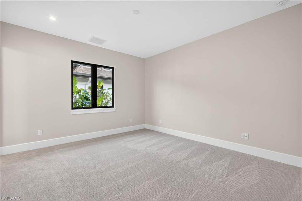 Bedroom 1 light earth tone pallet with light colored carpet