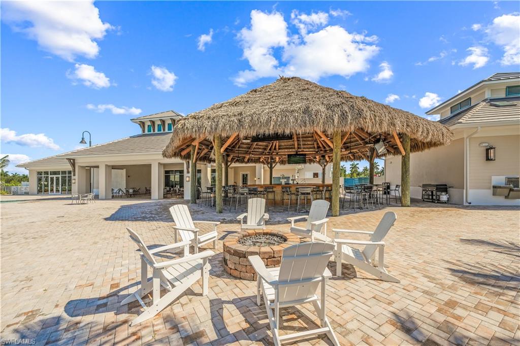 View of patio featuring a gazebo and a fire pit