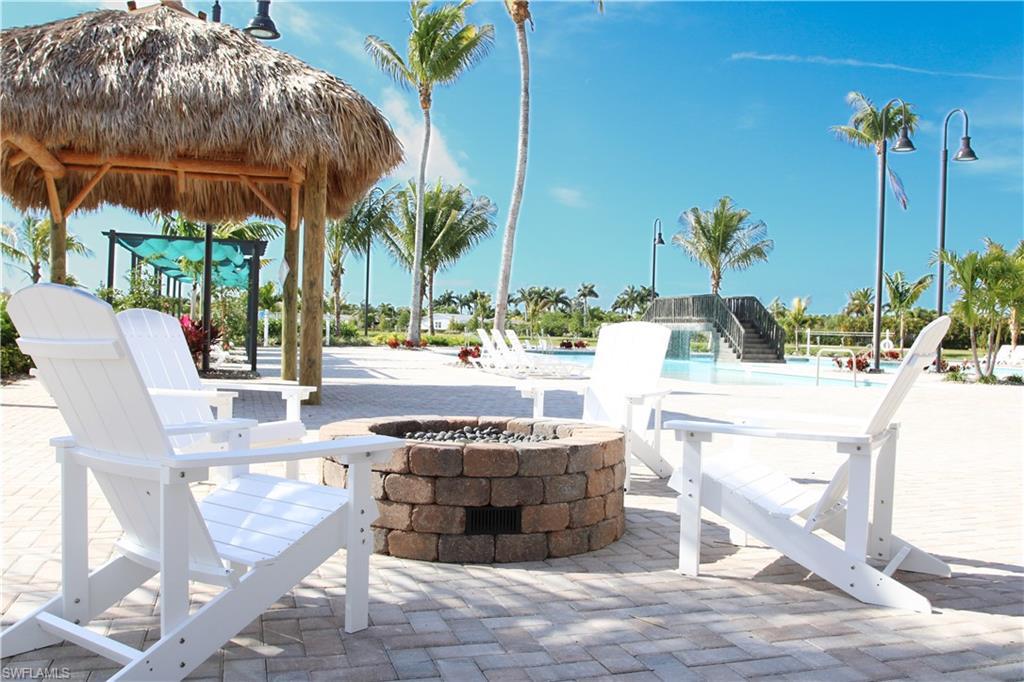 View of patio with a gazebo and an outdoor fire pit