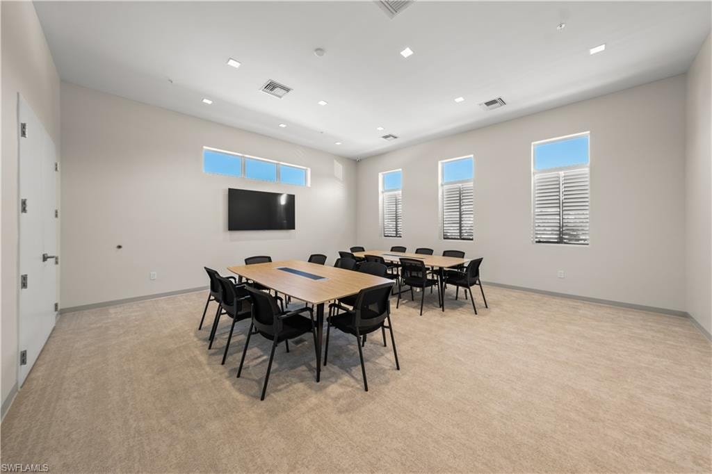 Dining space with light carpet