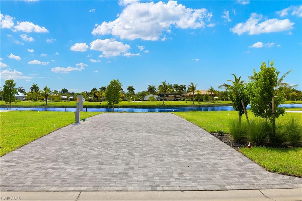 View of example RV Lot featuring a water view and a yard
