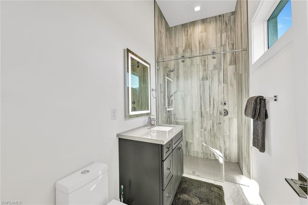 Guest bedroom bath with walk-in tiled shower