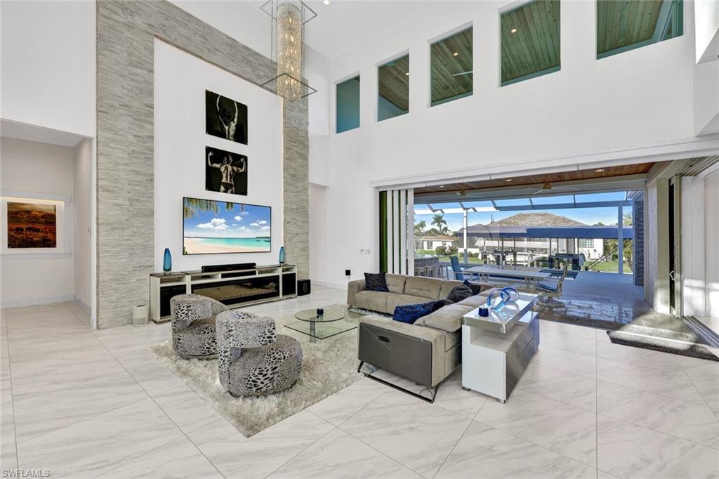 Backlit stack stone accent wall & 20 ft of disappearing pocket impact sliders leading to your awesome patio area