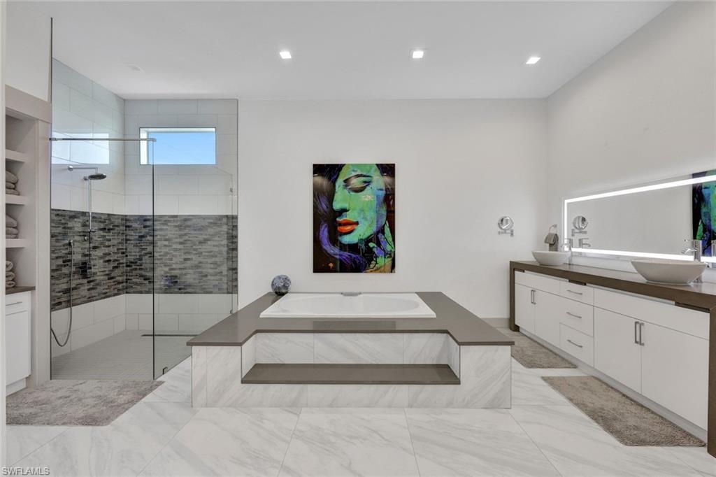 1st Floor Luxurious Master Bath with Large Jacuzzi Soaker Tub & Tiled Walk In Shower
