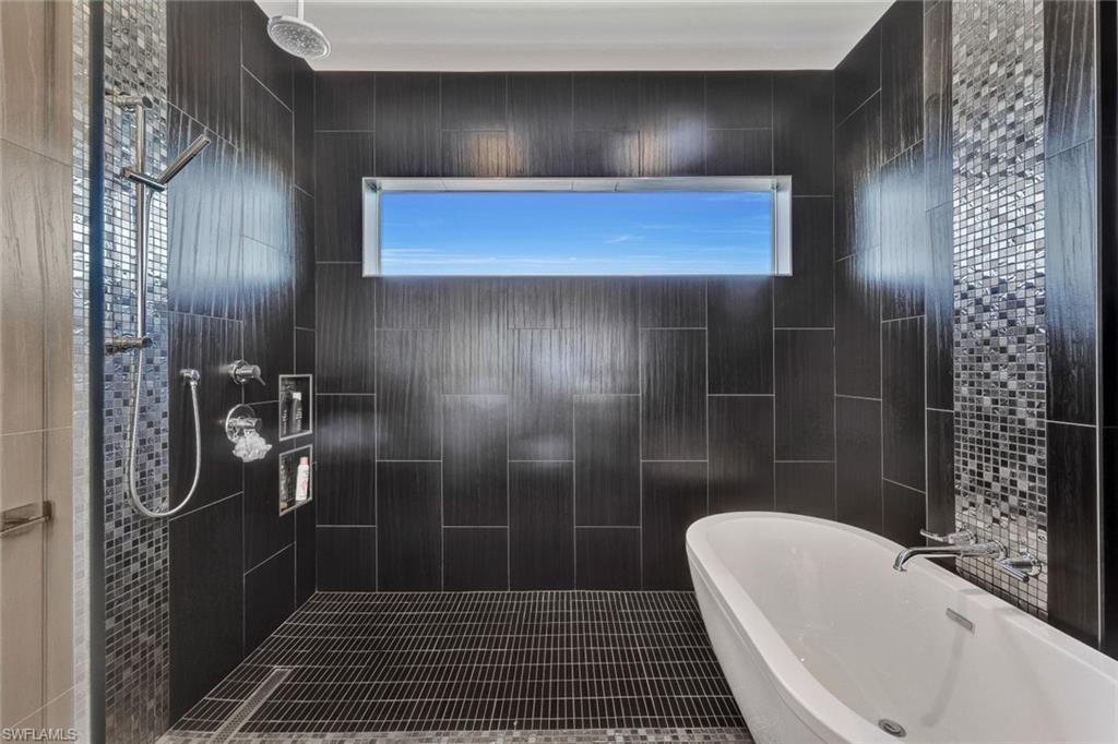 2nd floor bath with huge walk-in shower, multiple shower heads & stylish tub