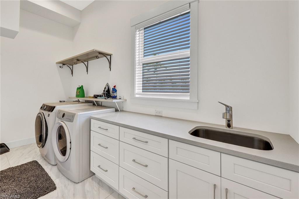 Large laundry room with sink & plenty of storage
