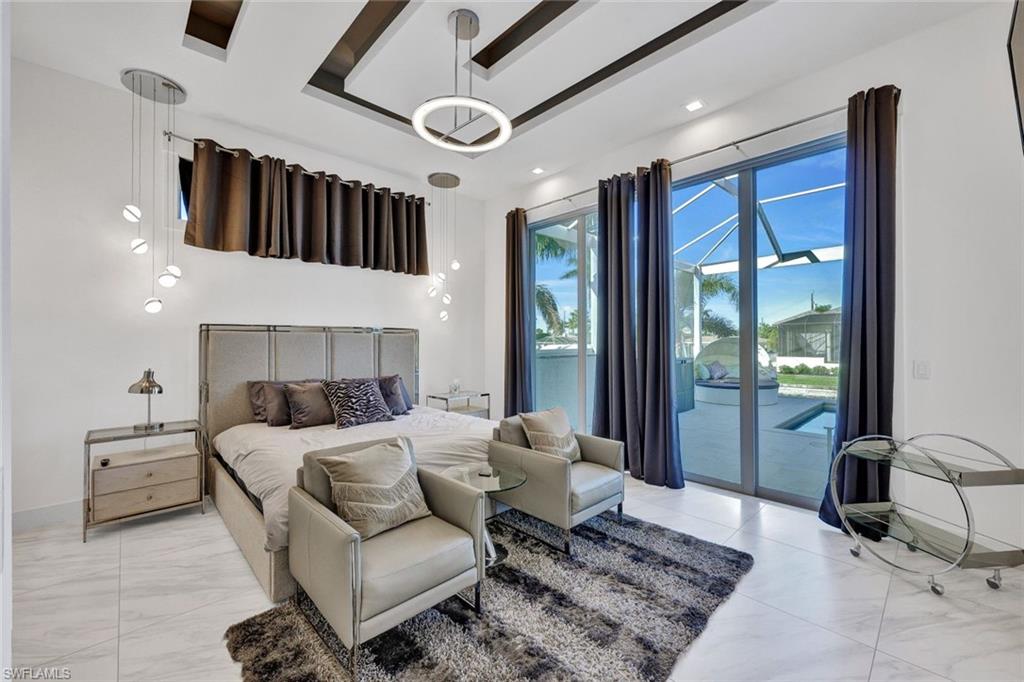 1st Floor Master Bedroom with Sliders that Lead to the Huge Pool Area