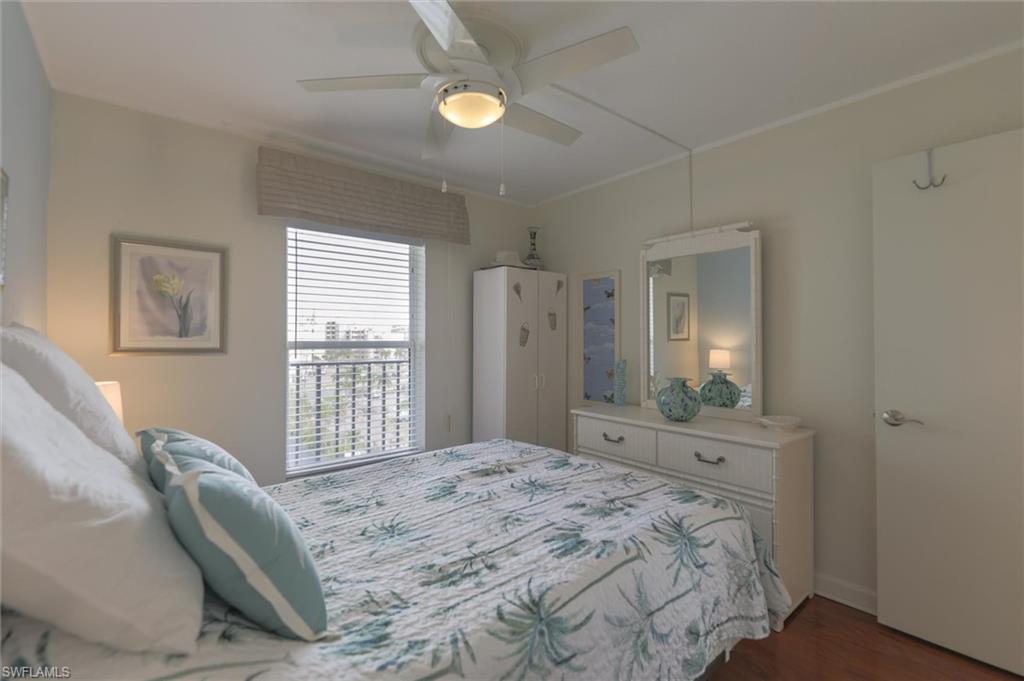 Bedroom with wood-type flooring and ceiling fan