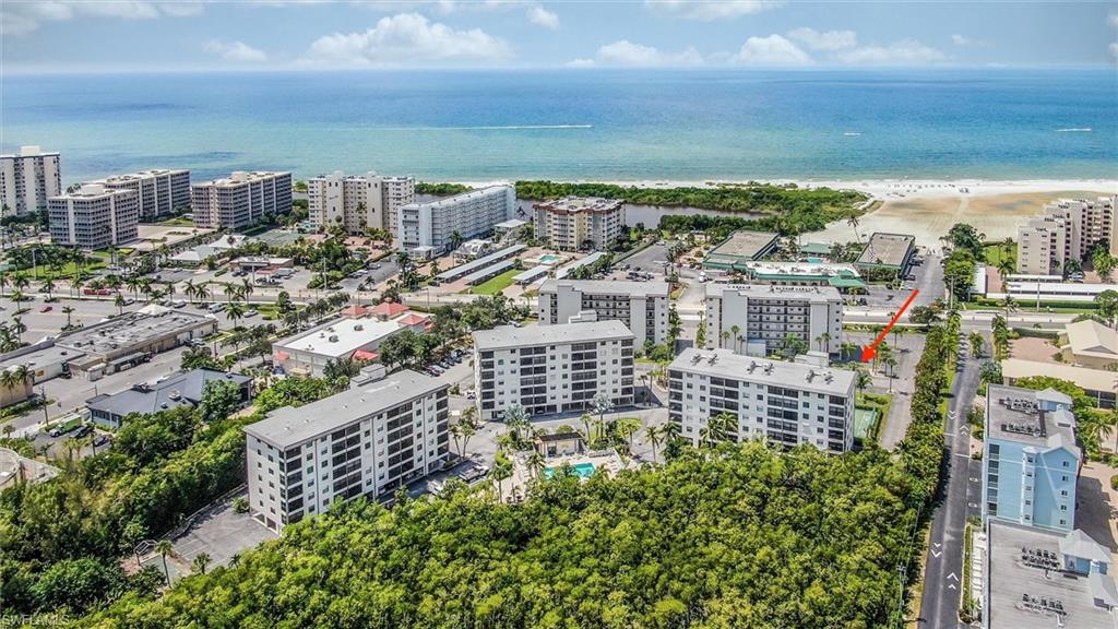 Aerial view with a beach view and a water view