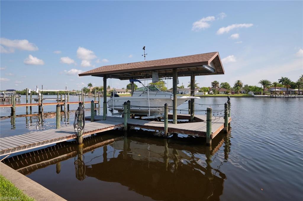 View of dock with a water view