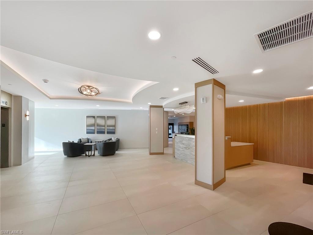 Lobby with recessed lighting and wood walls