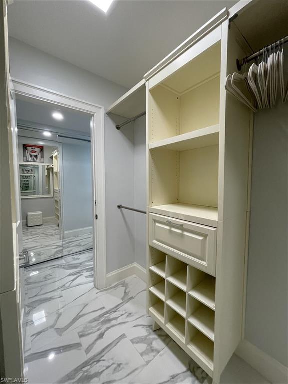 View of walk in primary closet
