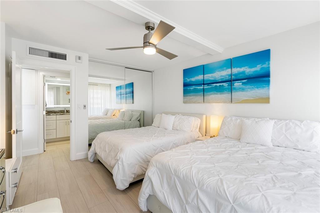 Bedroom featuring a closet, ceiling fan, and light hardwood / wood-style flooring