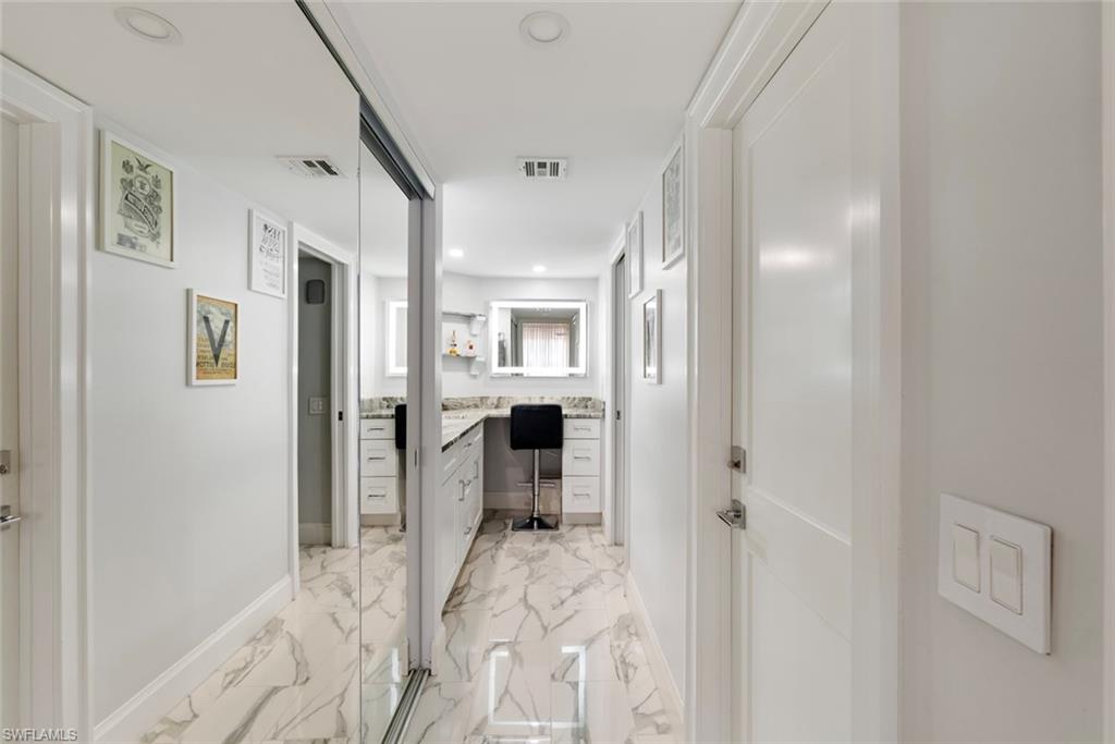 Hall featuring light tile floors