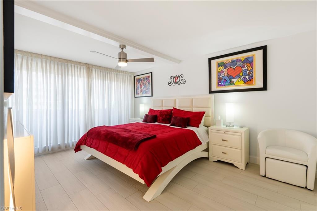 Bedroom featuring beam ceiling and ceiling fan