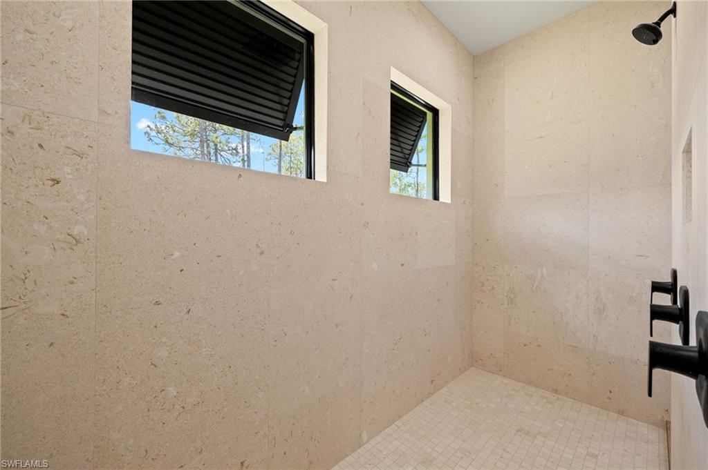 Bathroom with tiled shower
