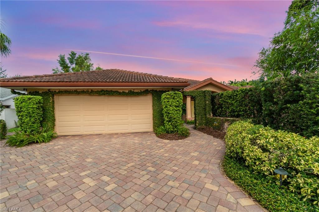 View of front of home featuring a garage
