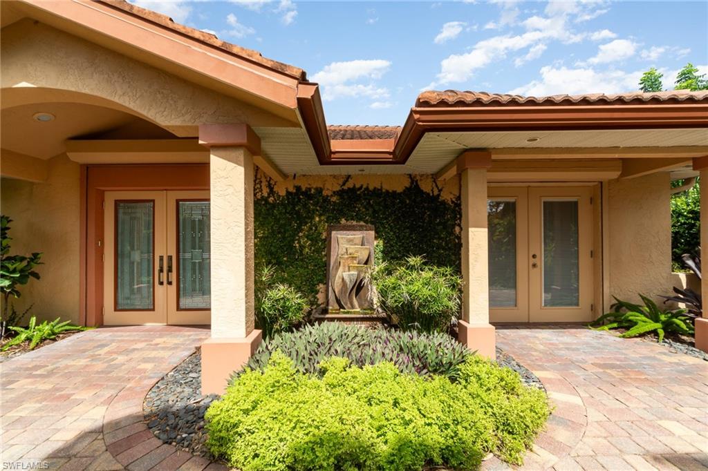Property entrance featuring french doors
