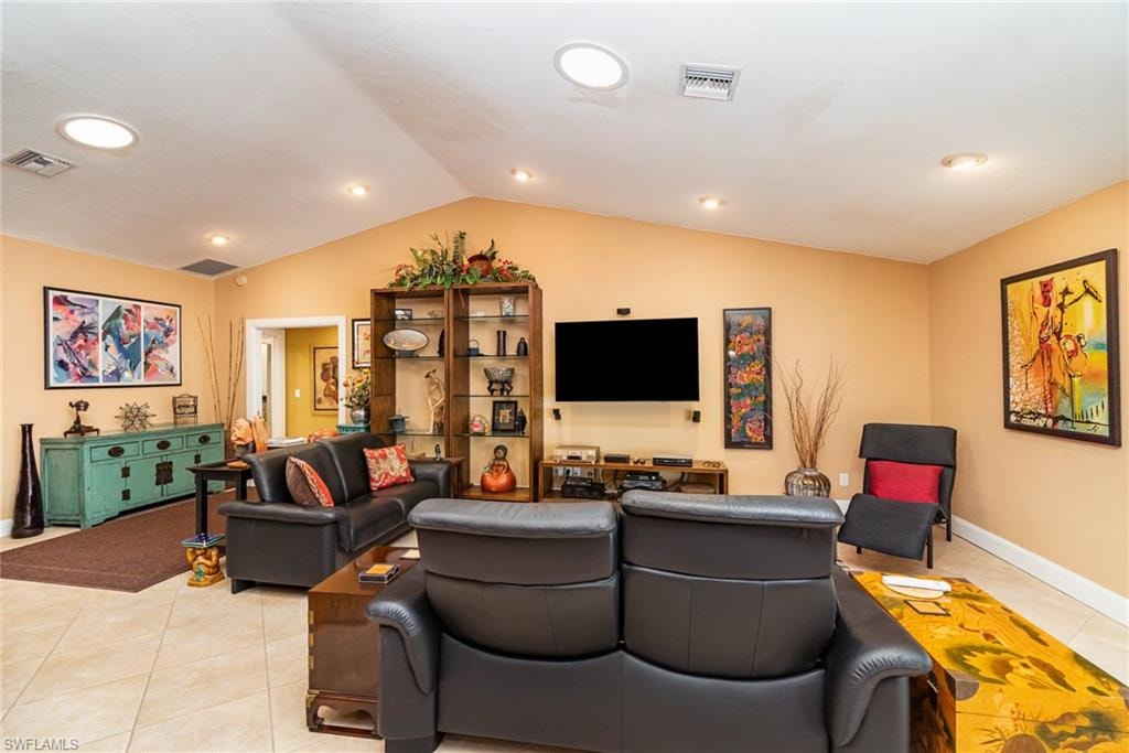 Tiled living room with vaulted ceiling