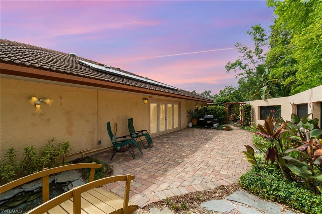 Patio terrace at dusk with french doors