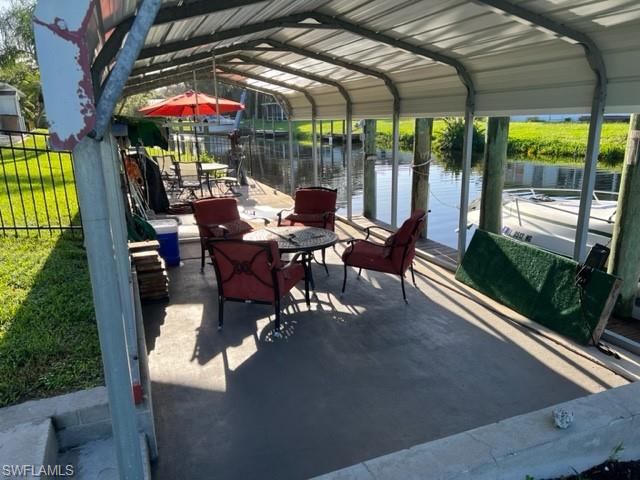 Dockside covered area for entertaining.  Easy on and off boat.  Davit in distance works but Seller doesn't use it so not guaranteed to be working.
