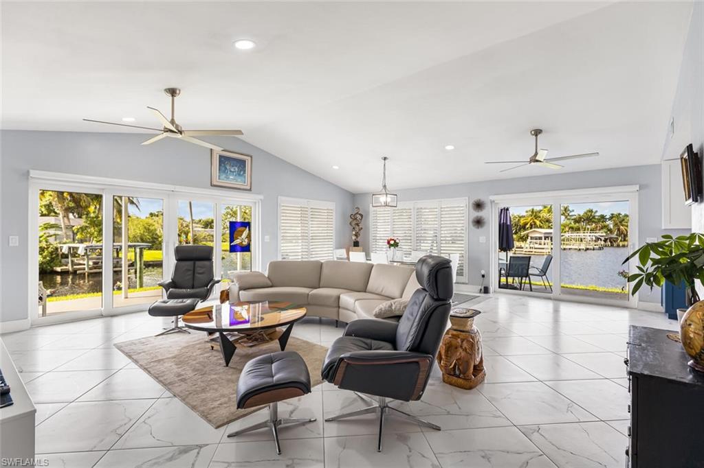 Porcelain tile 24" x 24" set on diagonal throughout home.  Window coverings are remote controlled blinds.  Volume ceilings and recessed lights are great features.