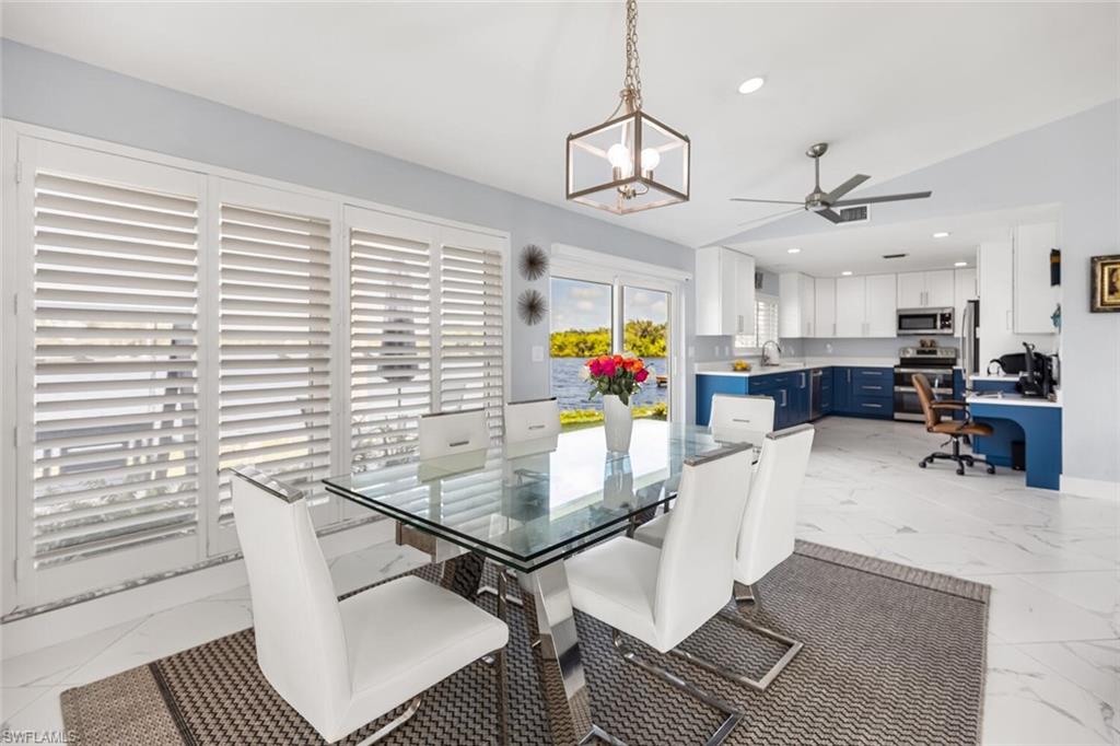 Conveniently located the dining  room is close to the kitchen.  Every view is to the water!