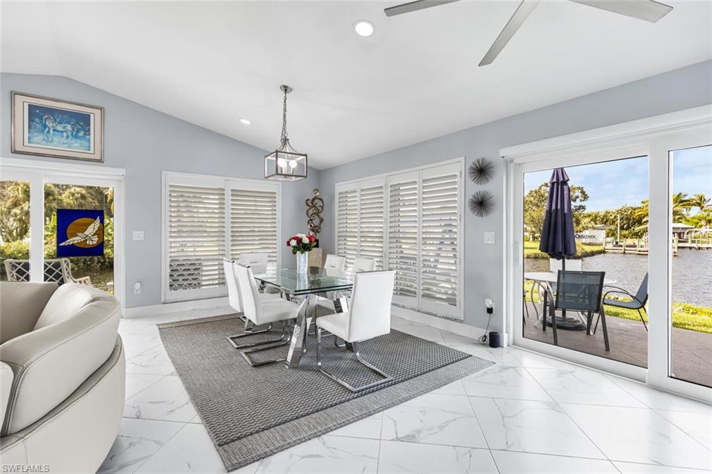 Dining room windows are adjustable wooden plantation shutters. Plenty of room to host larger dinners with spectacular views west.  Watch sunset from dining room.